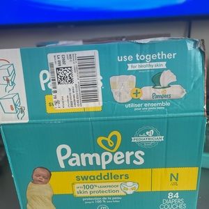 New born swaddle Pampers